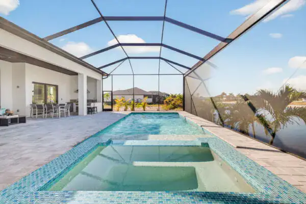 Custom home pool with screen-enclosed lanai built by Conquest Builders Corp in Cape Coral, Florida